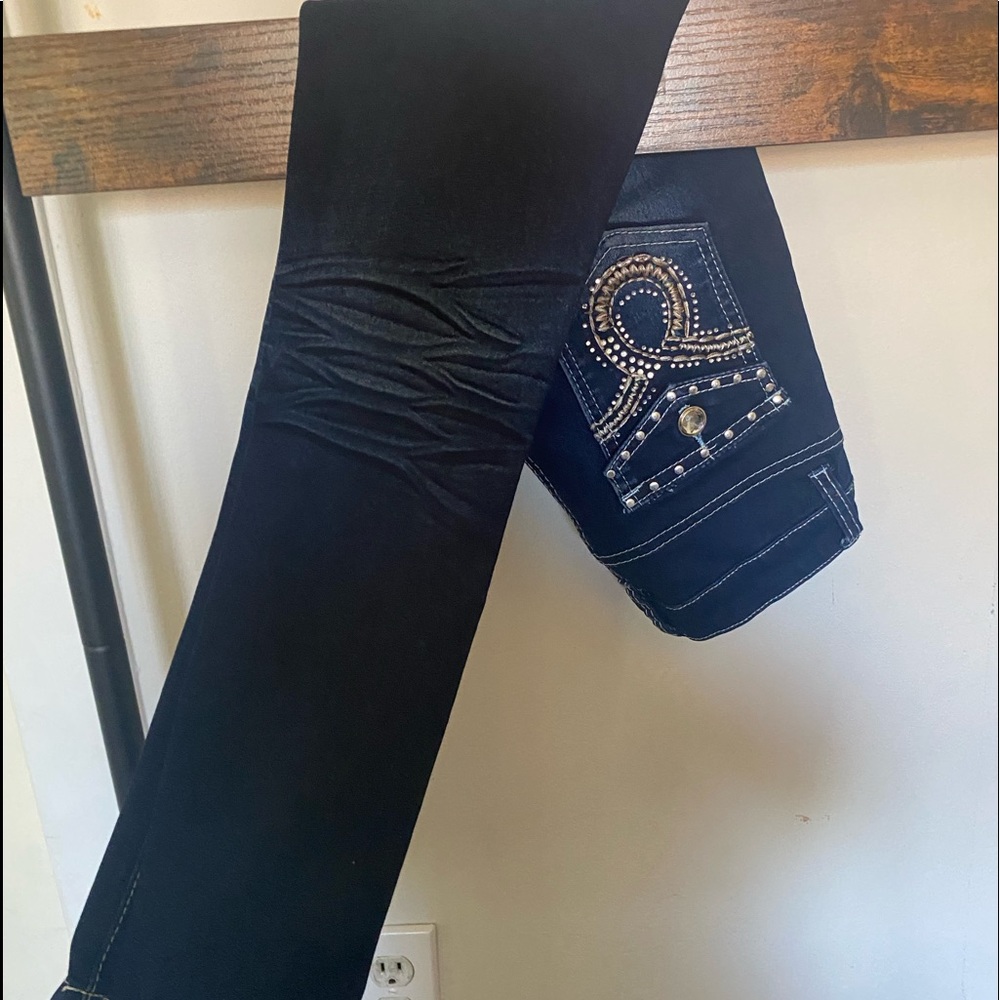 dark blue jeans. size 10. cute rips.